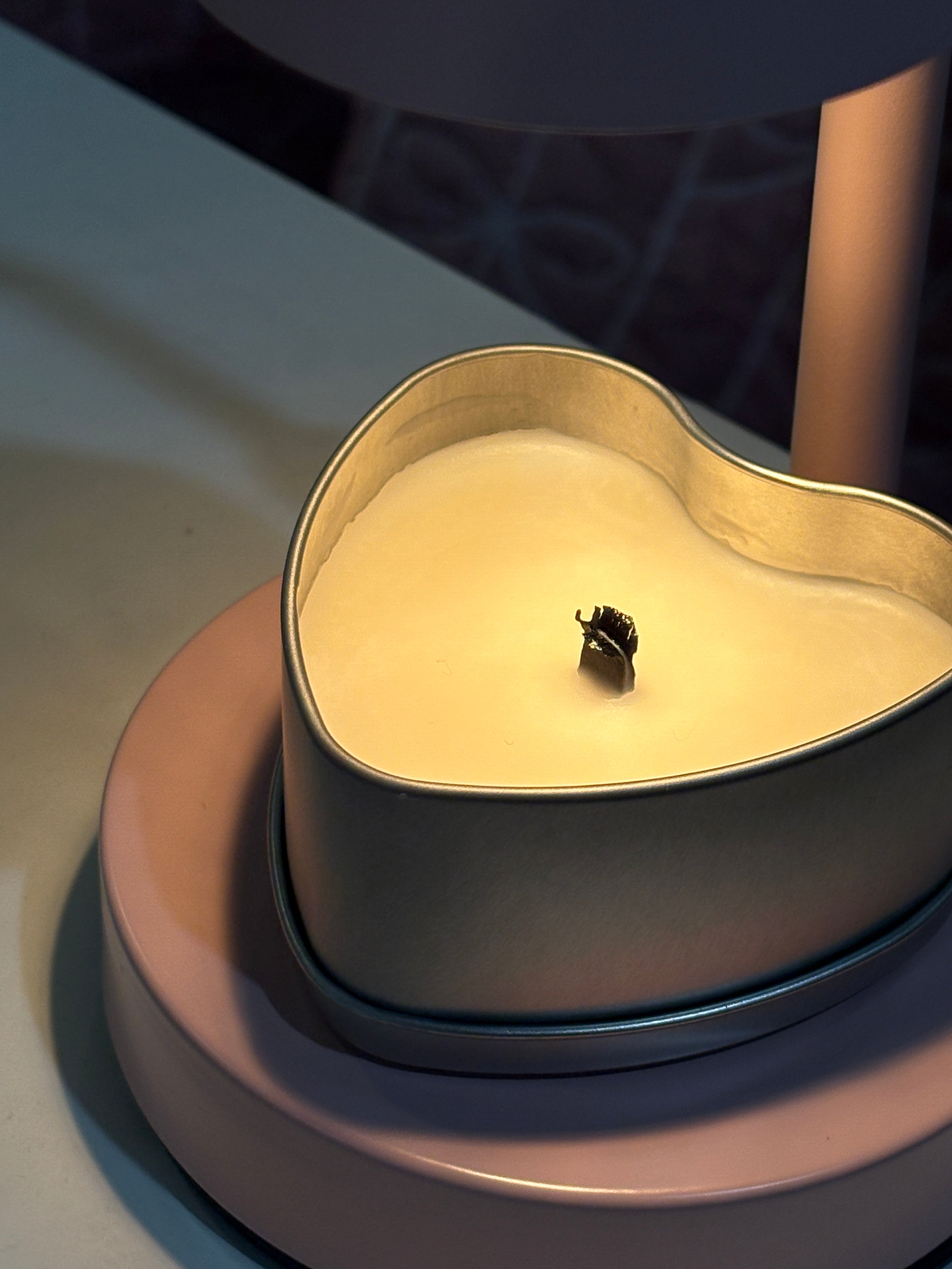 'bit of cherry' drink-inspired candle under a pink wax melt lamp 